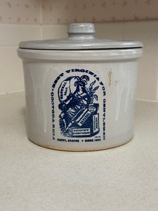 lot 27 image: Vintage Stoneware Tobacco Jar & Lid, featuring a Fine Tobacco Best Virginia advertisement graphic.