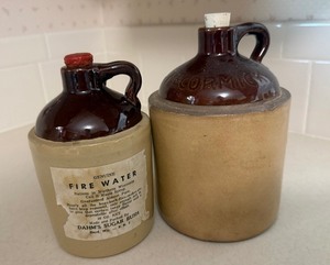 lot 40 image: Vintage Stoneware Syrup Jug & McCormick Crock Jug Lot