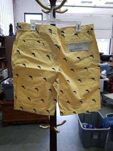 lot 3734 image: Hudson & Barrow Yellow Dolphin Print Swim Shorts Size 36