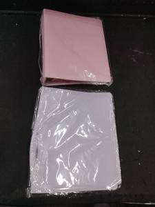lot 6182 image: Two binders pink and purple purple one has a damaged back
