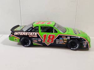 lot 105 image: Dale Jarrett #18 Interstate Batteries NASCAR Diecast Car 118