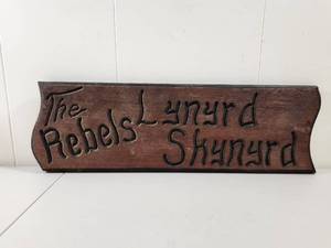 lot 233 image: The Rebels Lynrd Skynrd Carved Wood Sign