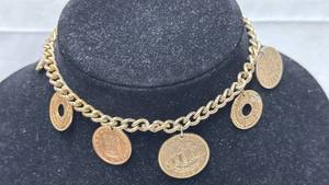 lot 178 image: Gold Tone Charm Bracelet with International Coin Charms