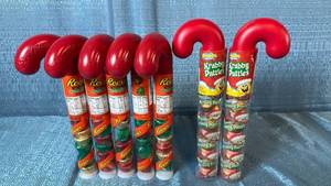 lot 2076 image: Holiday Candy Cane Tubes with Reeses and SpongeBob Krabby Patties