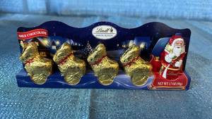 lot 2105 image: Lindt Santa Sleigh Milk Chocolate Gold Reindeer Set 20 Count