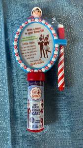 lot 2118 image: Elf on the Shelf Dry Erase Message Board with Candy Inside 12 Count.