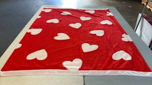 lot 8079 image: Red Plush Throw Blanket with White Heart Pattern