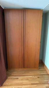 lot 200 image: Danish teak armoire located upstairs 80x45x23 will need to be disassembled for removal, excellent condition