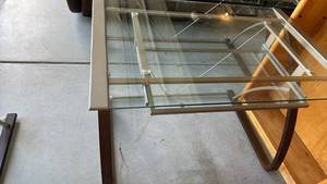 lot 306 image: Metal and tempered glass top desk with pullout tray 30x42x28 located in garage