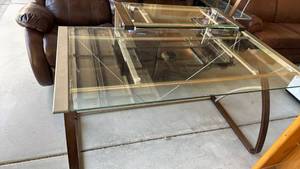 lot 307 image: Metal and tempered glass top desk with glass shelf 30x55x28 located in garage