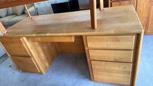 lot 308 image: Wood desk with drawers 30x72x30 located in garage