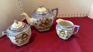 lot 1013 image: Japan hand painted teapot, creamer and sugar