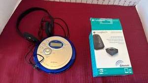 lot 1027 image: Audiophase blue portable CD player with an AMFM tuner and Logitech audio adapter new in box