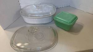lot 1112 image: Corning Ware Casserole Dishes with Glass Lids and Green glass container