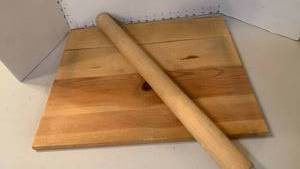 lot 1133 image: Wooden cutting board and rolling pin