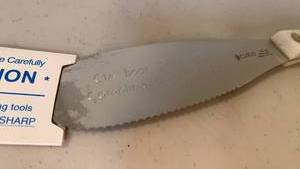 lot 1135 image: Cutco CIA Boot camp spreader with white handle