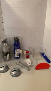 lot 1305 image: Misc items including measuring cup, travel bottles, and more