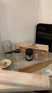 lot 1326 image: Misc kitchen items, Tupperware rolling mat, thermos, bowls, carafe, glasses and more