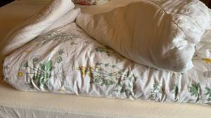 lot 1501 image: Queen comforter and misc mattress pads full and queen Some staining
