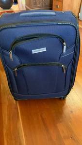 lot 1553 image: Perry Ellis rolling luggage 21X14X9