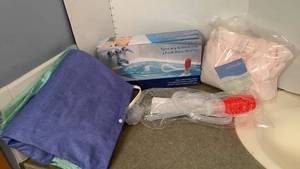 lot 1573 image: Heating pads, water Bob and shower wrap