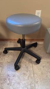 lot 2004 image: Rolling stool adjustable height  22x15 dia located in basement has walkout