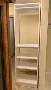 lot 2102 image: White Closet Organizer System with Shelving and Hanging Rod 85x24X14 located in basement