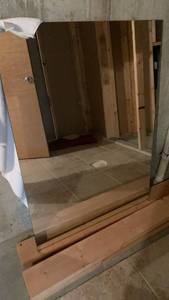lot 2501 image: Large Rectangular Wall Mirror 44x32 located in basement