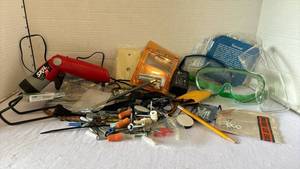 lot 3112 image: Safety glasses, Skil 2.4 volt drill, and miscellaneous screws, etc.