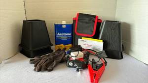 lot 3124 image: Miscellaneous Garage Items including Jump Starter, bed risers and acetone, and more