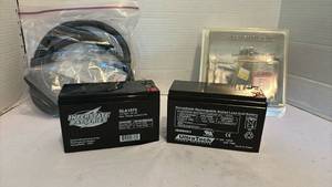 lot 3135 image: Two 12V Rechargeable Batteries, split flex tubing and assortment of nails