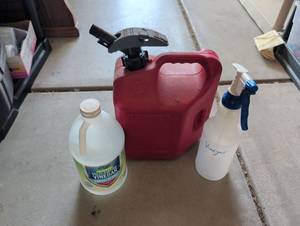 lot 3329 image: Red Plastic Gas Can with Spout and Cleaning Supplies