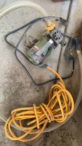 lot 4101 image: Small non submersible pump and extension cord located under the deck