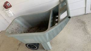 lot 4107 image: AMES EasyRoller Plastic garden cart 30x43x21 located under deck