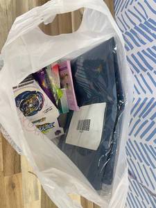 lot 311434 image: 15 Item Mystery Bag (misc. makeup, phone accessories, electronics, hug toys, stuffed animals, keychains, household items, etc.)