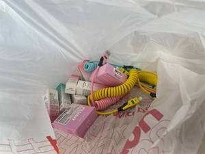 lot 311449 image: 15 Item Mystery Bag (misc. makeup, phone accessories, electronics, hug toys, stuffed animals, keychains, household items, etc.)