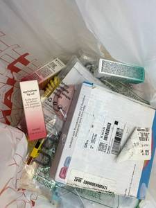 lot 411378 image: 15 Item Mystery Bag (misc. makeup, phone accessories, electronics, toys, stuffed animals, keychains, household items, etc.)