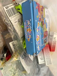 lot 411379 image: 15 Item Mystery Bag (misc. makeup, phone accessories, electronics, toys, stuffed animals, keychains, household items, etc.)