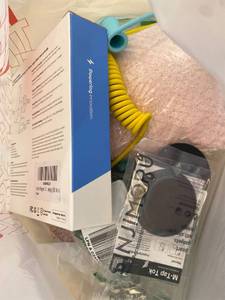 lot 411385 image: 15 Item Mystery Bag (misc. makeup, phone accessories, electronics, toys, stuffed animals, keychains, household items, etc.)