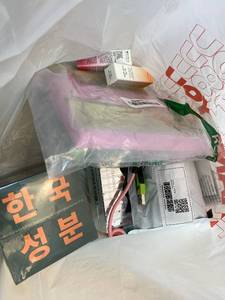 lot 411386 image: 15 Item Mystery Bag (misc. makeup, phone accessories, electronics, toys, stuffed animals, keychains, household items, etc.)