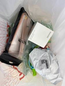 lot 411391 image: 15 Item Mystery Bag (misc. makeup, phone accessories, electronics, toys, stuffed animals, keychains, household items, etc.)
