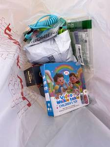 lot 411395 image: 15 Item Mystery Bag (misc. makeup, phone accessories, electronics, toys, stuffed animals, keychains, household items, etc.)