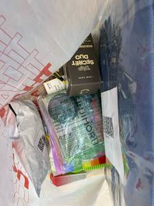 lot 411402 image: 15 Item Mystery Bag (misc. makeup, phone accessories, electronics, toys, stuffed animals, keychains, household items, etc.)