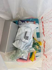 lot 411412 image: 15 Item Mystery Bag (misc. makeup, phone accessories, electronics, toys, stuffed animals, keychains, household items, etc.)