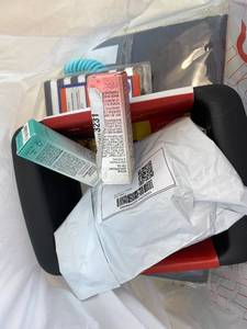lot 411413 image: 15 Item Mystery Bag (misc. makeup, phone accessories, electronics, toys, stuffed animals, keychains, household items, etc.)