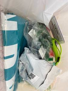 lot 411415 image: 15 Item Mystery Bag (misc. makeup, phone accessories, electronics, toys, stuffed animals, keychains, household items, etc.)