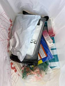lot 411416 image: 15 Item Mystery Bag (misc. makeup, phone accessories, electronics, toys, stuffed animals, keychains, household items, etc.)