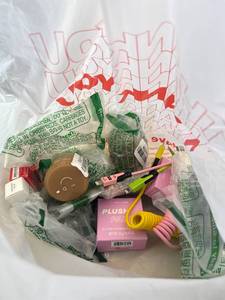 lot 411447 image: 15 Item Mystery Bag (misc. makeup, phone accessories, electronics, toys, stuffed animals, keychains, household items, etc.)