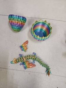 lot 33780 image: Flavery 3D Printed Dragon in Egg, Large 9 Flexible Winged Dragon Inside - Rainbow, Mystery Fidget Toy, Dorm Desk Decor Pet, Fantasy Graduation Gift for Kids, Teens & Adults, Dragon Lovers - Retail $15