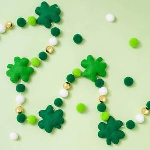 lot 33952 image: Whaline 8.2 Ft St. Patricks Day Felt Banner 3D Lucky Shamrock Clover with Gold Bead Hanging Garland Green White Pom Ball Banner for Irish Holiday Home Wall Fireplace Decor - Retail $21